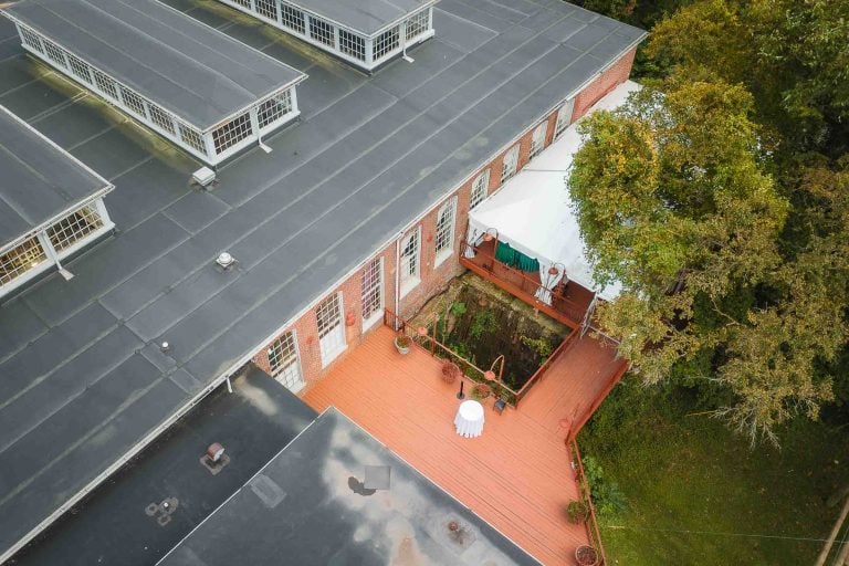 An aerial view of the wedding details on the roof of the Savage Mill building.