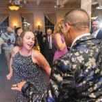 A man and woman dancing at a wedding reception held at Savage Mill.