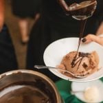 Chocolate ice cream being poured into a bowl at Savage Mill.