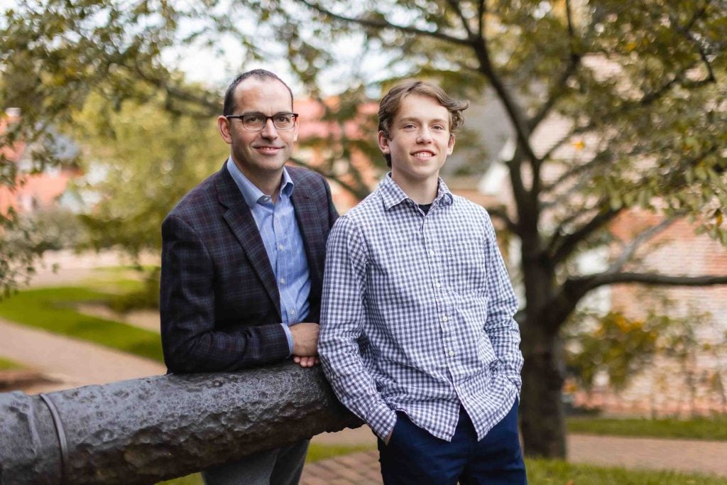 Two men posing for a photo in Downtown Annapolis.