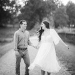 An engaged couple walking down a path during sunset in Maryland.